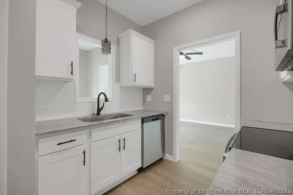 a kitchen with a sink and cabinets