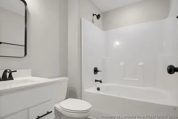 a bathroom with a sink a toilet and a bathtub