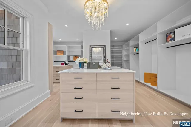 a bathroom with a double vanity sink a mirror and a shower