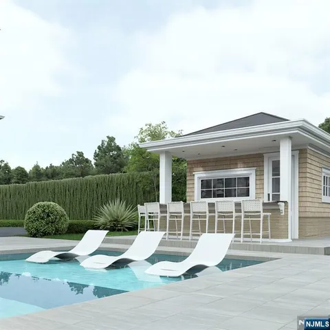 a view of a house with backyard and garden