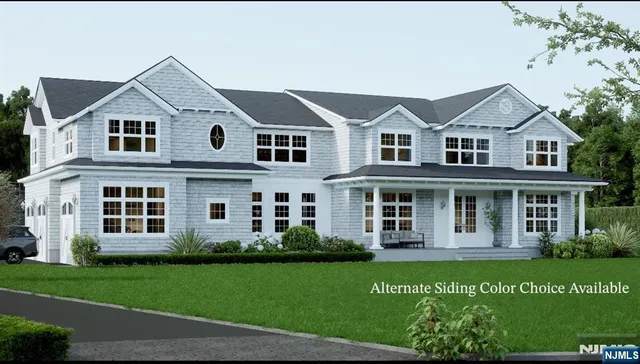 a view of a white house with a big yard and potted plants