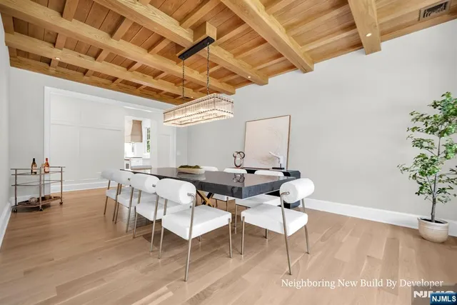a view of a livingroom with furniture window and wooden floor
