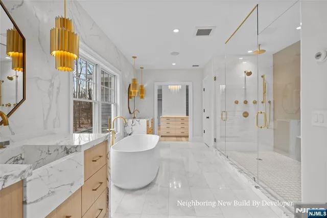 a spacious bathroom with a granite countertop sink a toilet and shower