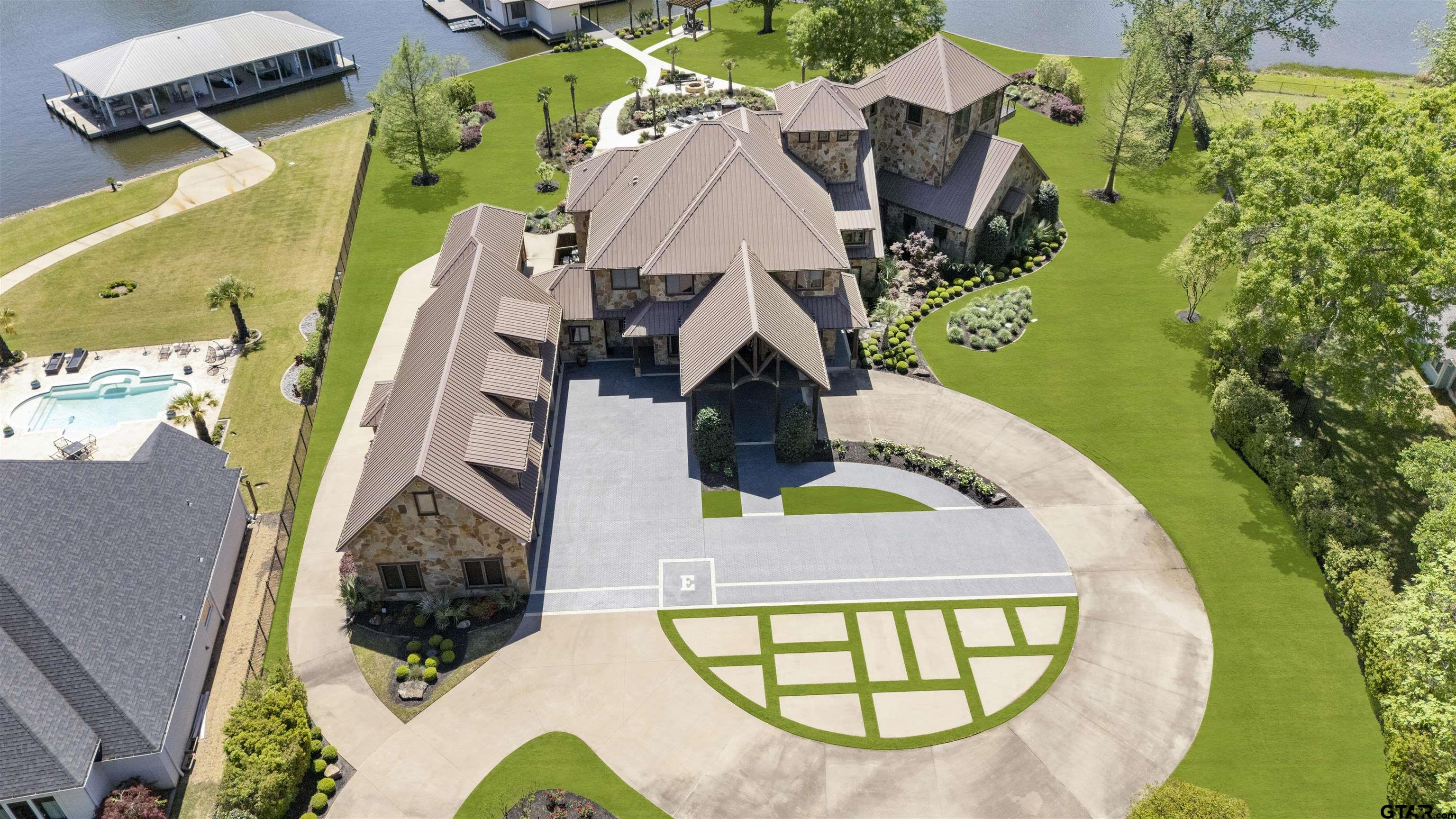 an aerial view of a house with a swimming pool