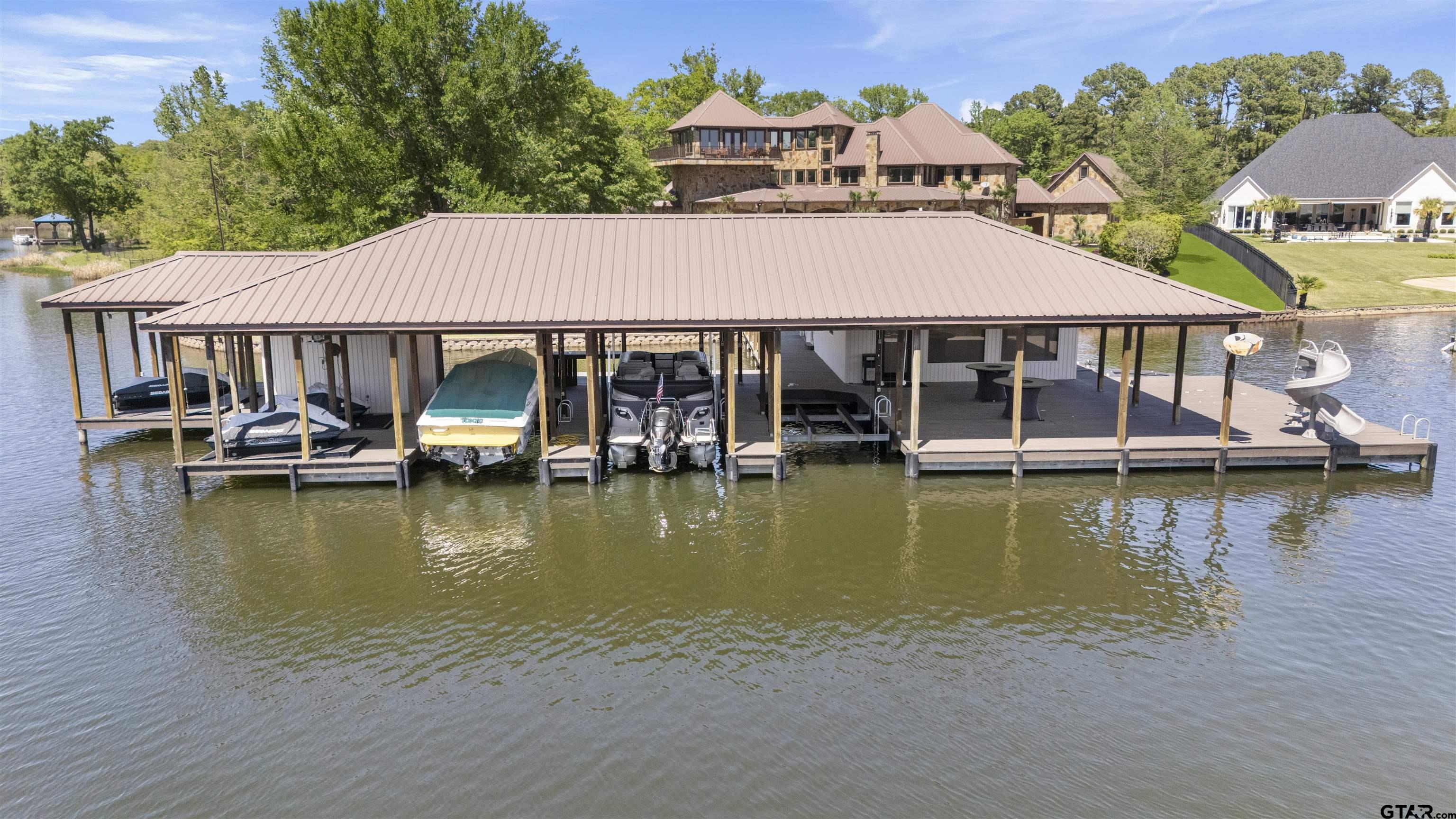 17873 Slack Road Whitehouse, TX 75791 - Photo 17 of 48 a view of a lake with a house swimming pool and outdoor space