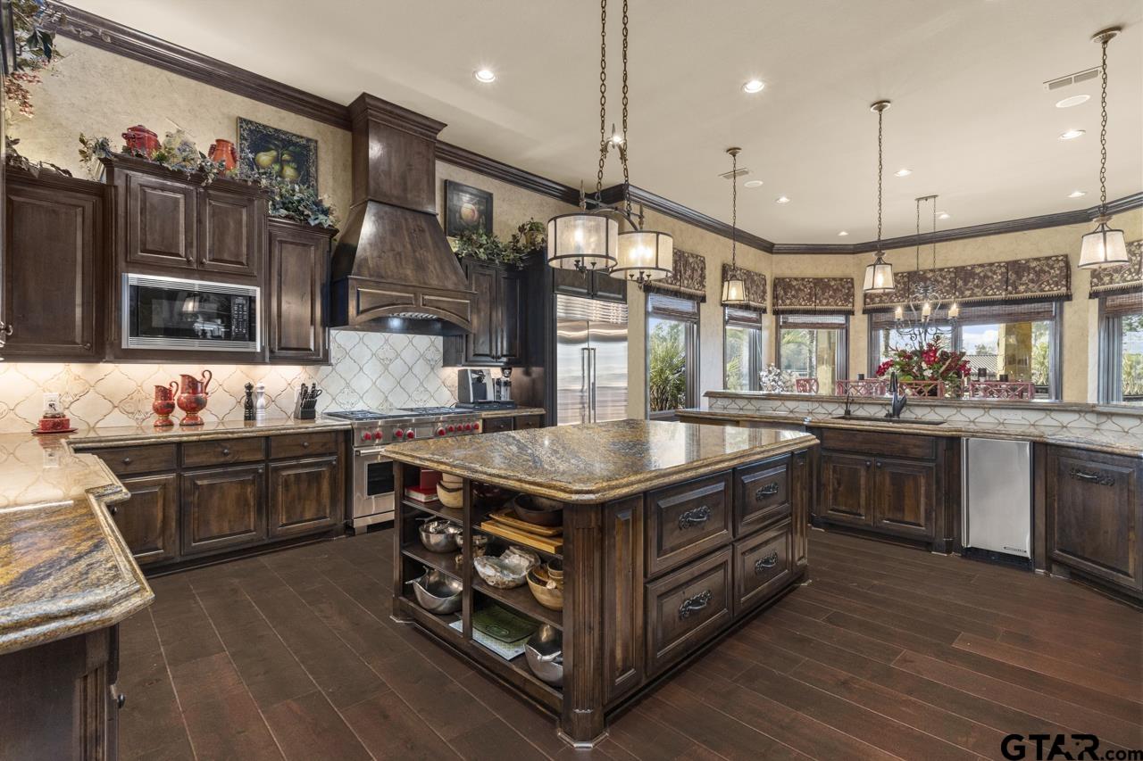 17873 Slack Road Whitehouse, TX 75791 - Photo 28 of 48 a kitchen with stainless steel appliances granite countertop a stove and a large cabinets
