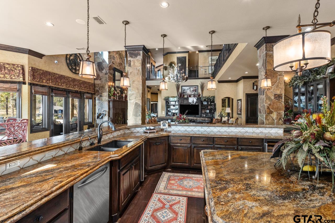 17873 Slack Road Whitehouse, TX 75791 - Photo 29 of 48 a kitchen with stainless steel appliances granite countertop a sink a stove and a wooden floors