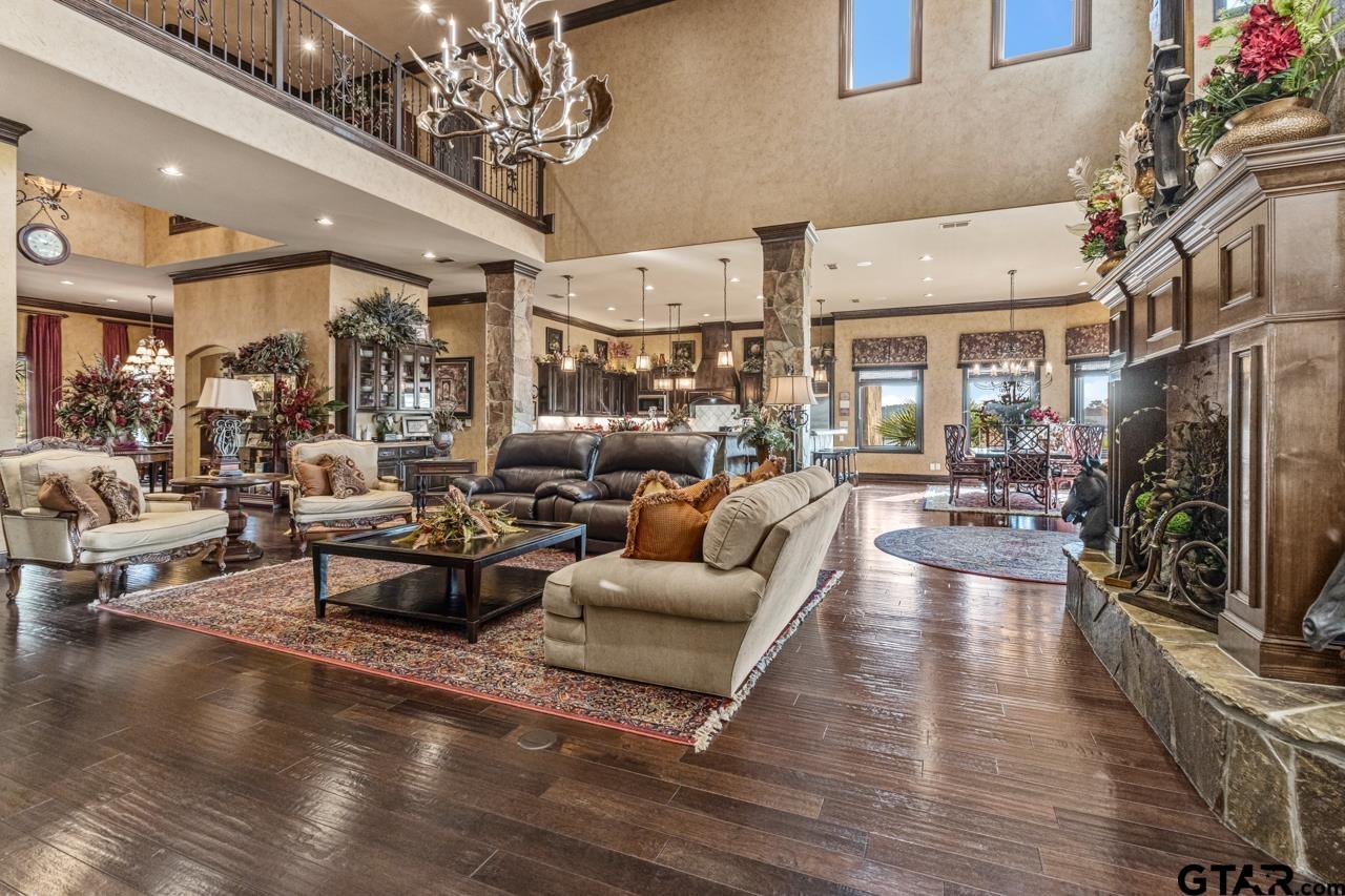 17873 Slack Road Whitehouse, TX 75791 - Photo 33 of 48 a living room with fireplace furniture and a chandelier