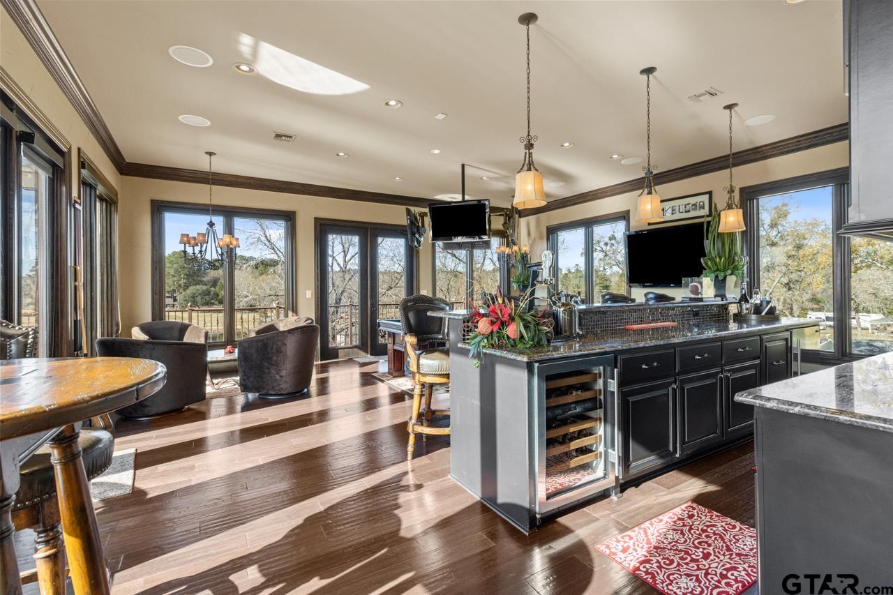 17873 Slack Road Whitehouse, TX 75791 - Photo 38 of 48 a kitchen with stainless steel appliances kitchen island granite countertop a stove and a sink