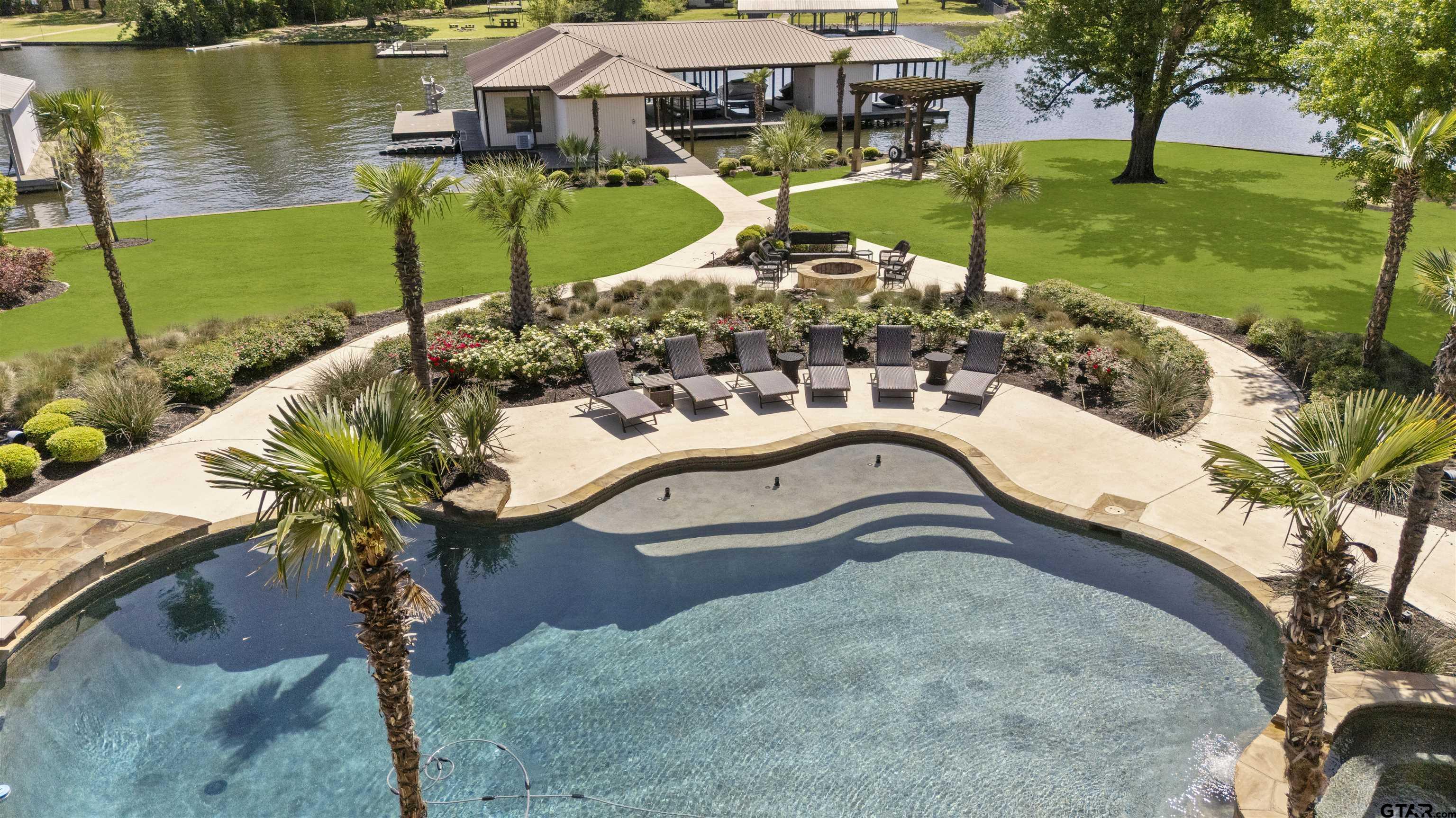 17873 Slack Road Whitehouse, TX 75791 - Photo 4 of 48 a view of a swimming pool with a yard and plants