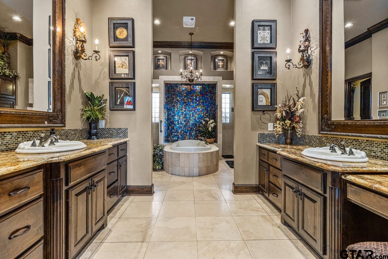17873 Slack Road Whitehouse, TX 75791 - Photo 42 of 48 a spacious bathroom with a sink double vanity and a mirror