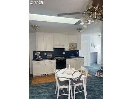 a kitchen with a table and chairs in it