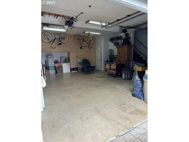 a view of a livingroom with furniture and a fan