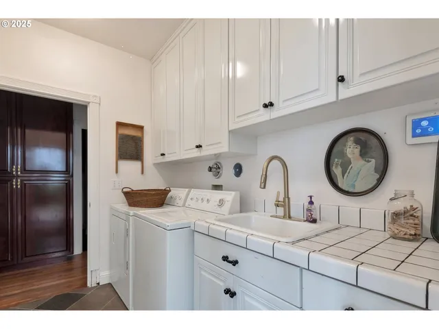 a kitchen with cabinets and a refrigerator