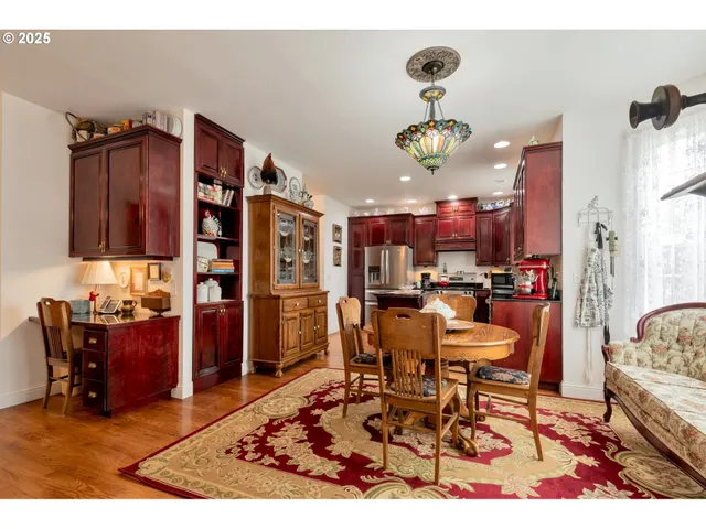 a living room with lots of furniture and kitchen view