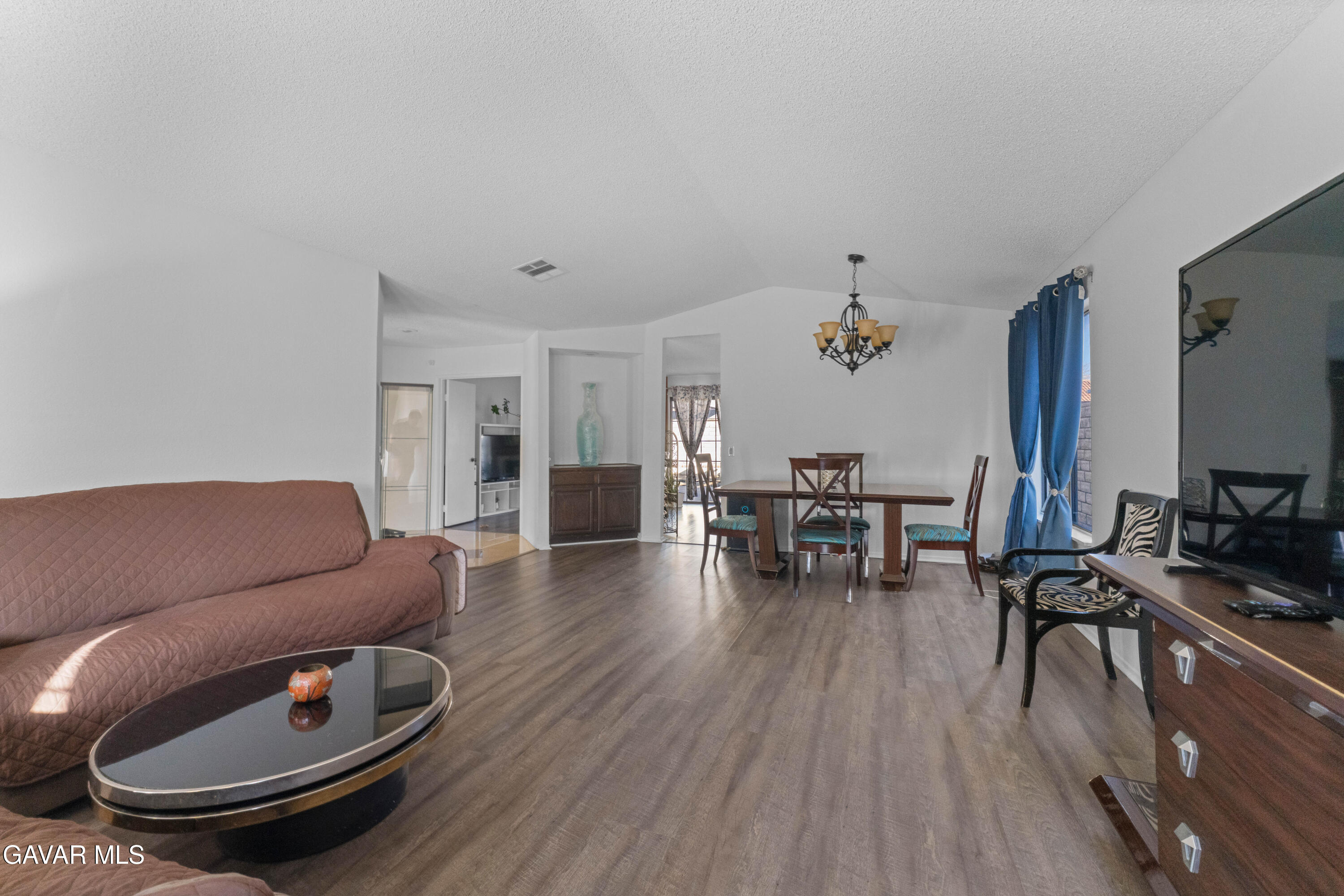 37720 Smoke Tree Street Palmdale, CA 93552 - Photo 4 of 17 a living room with furniture and wooden floor