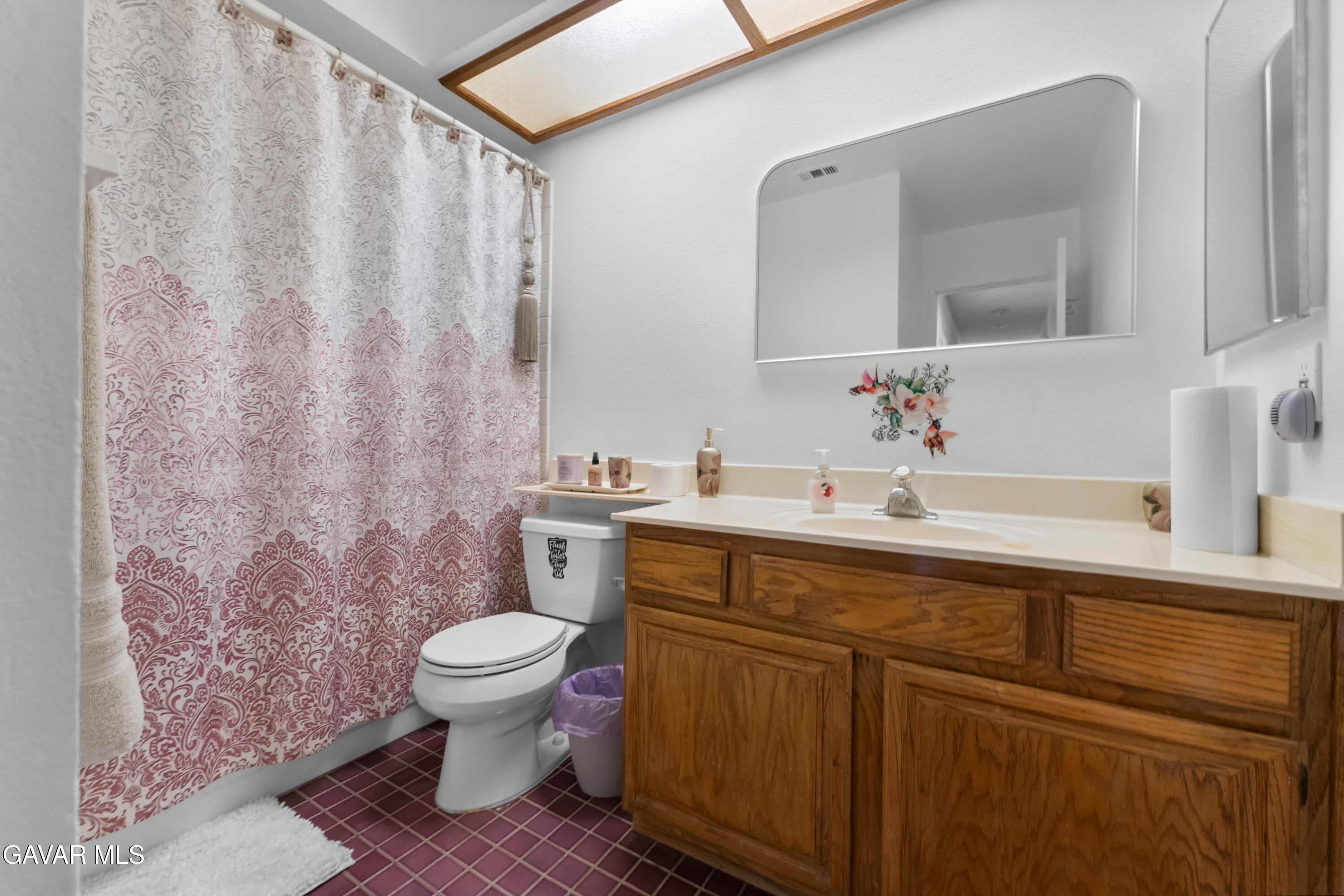 37720 Smoke Tree Street Palmdale, CA 93552 - Photo 8 of 16 a bathroom with a sink a toilet and a mirror