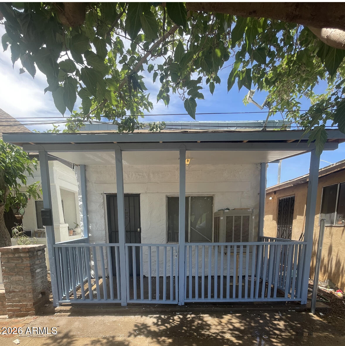 538 East E Avenue Douglas, AZ 85607 - Photo 1 of 14 a view of a house with a small yard and wooden fence