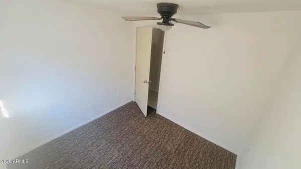 a view of a hallway with a window