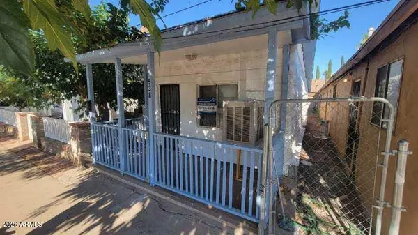 a view of a house with street from a balcony