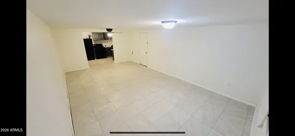 a view of a storage & utility room with a microwave