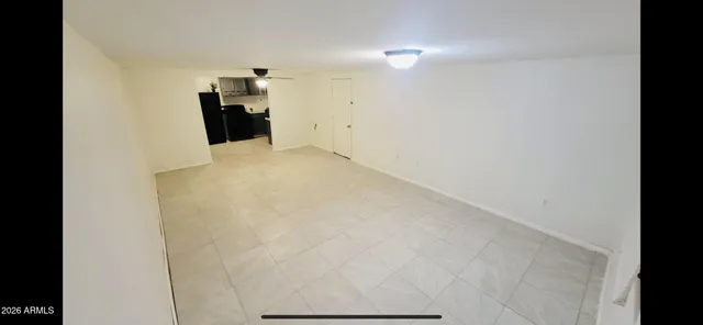 a view of a storage & utility room with a microwave