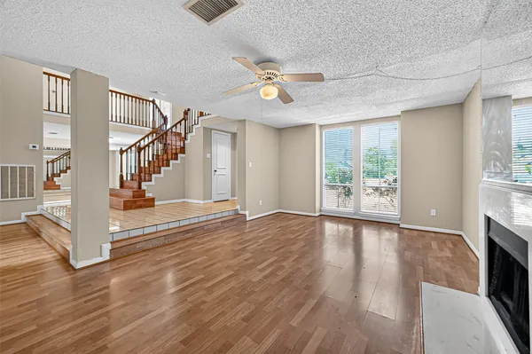 a view of an entryway with wooden floor and a window