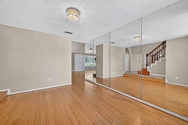 a view of an entryway with wooden floor