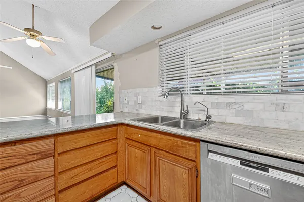 a large bathroom with a tub a sink and a shower