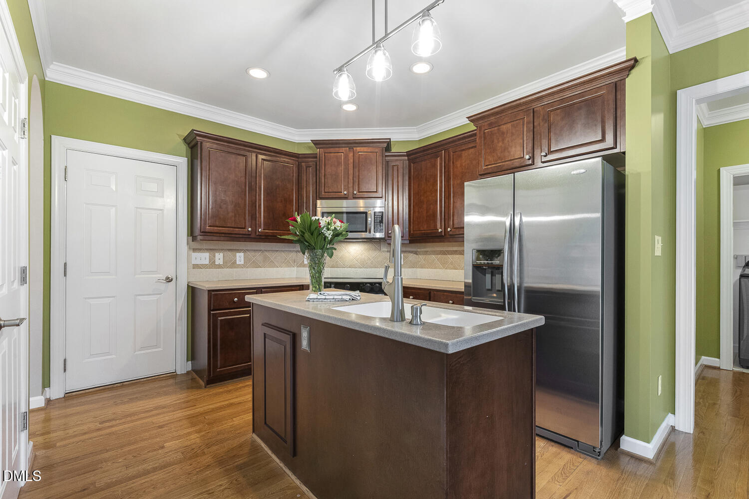 1119 Corrina Road Wake Forest, NC 27587 - Photo 14 of 45 a kitchen with kitchen island granite countertop cabinets and stainless steel appliances