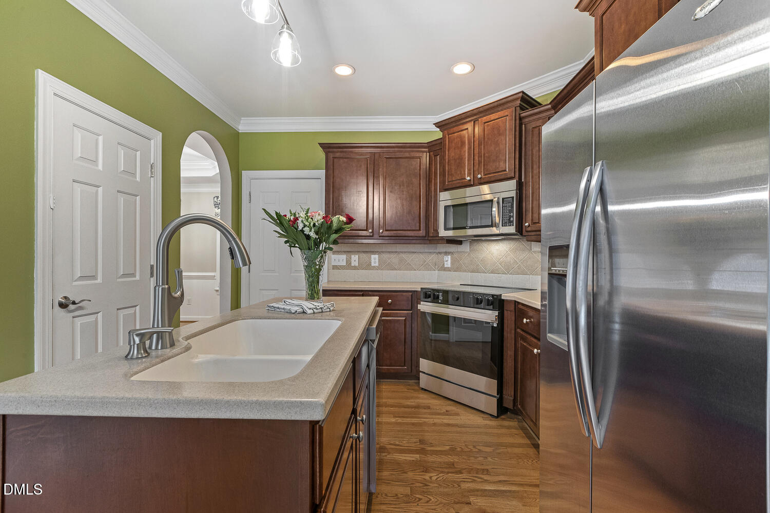 1119 Corrina Road Wake Forest, NC 27587 - Photo 17 of 45 a kitchen with stainless steel appliances granite countertop a sink a stove and a refrigerator