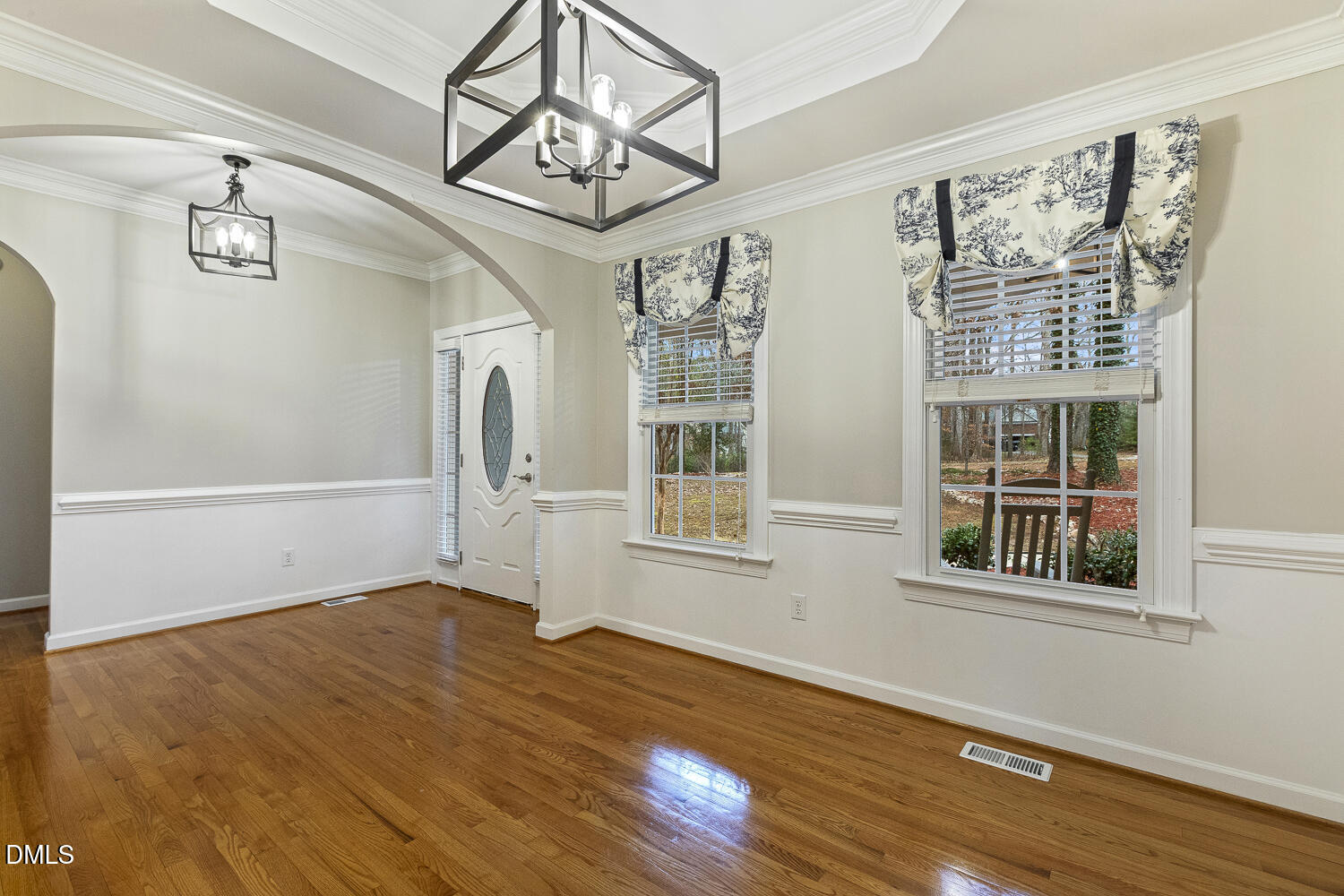 1119 Corrina Road Wake Forest, NC 27587 - Photo 6 of 45 a view of empty room with wooden floor and fan