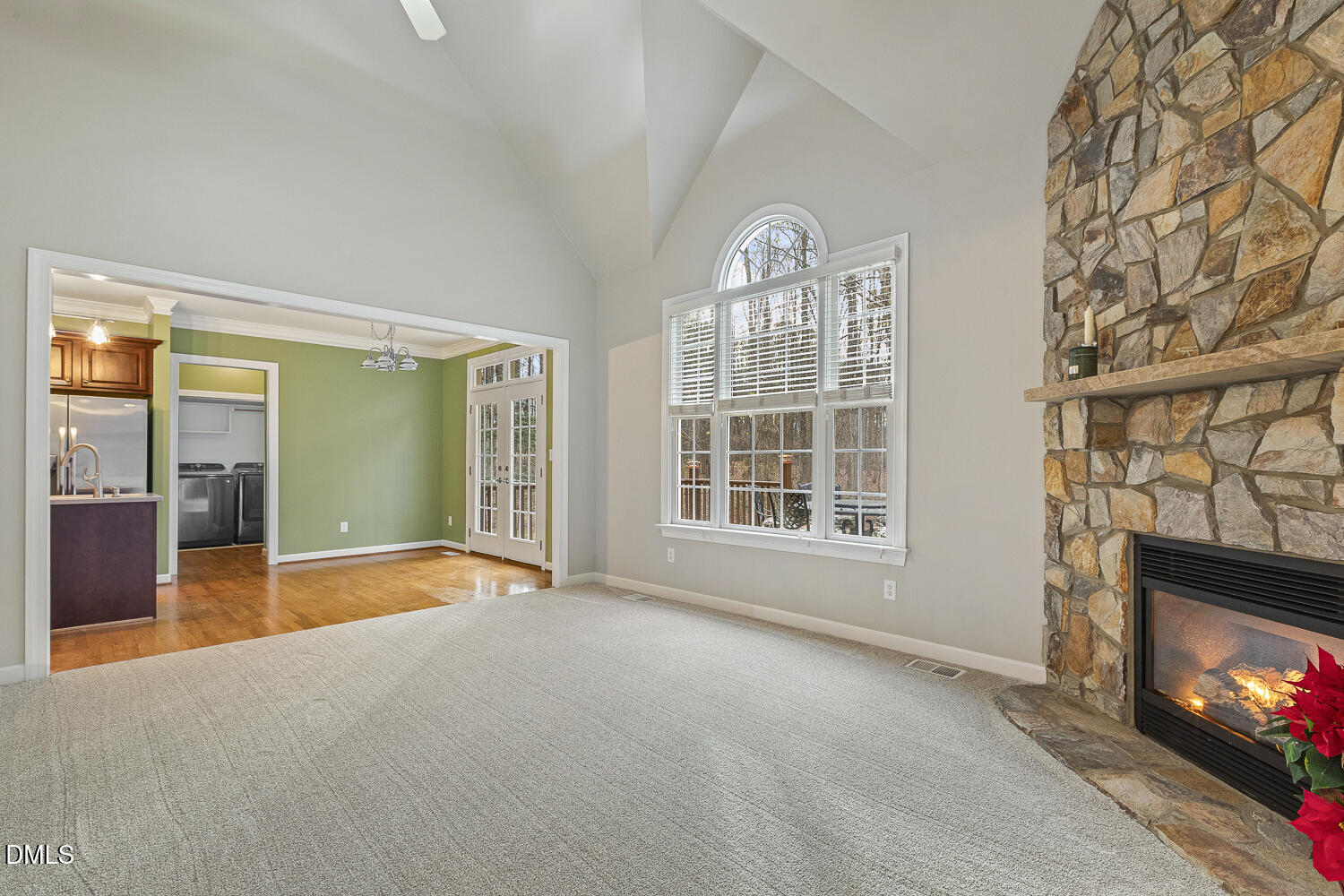 1119 Corrina Road Wake Forest, NC 27587 - Photo 8 of 45 a view of an empty room with a fireplace and a window