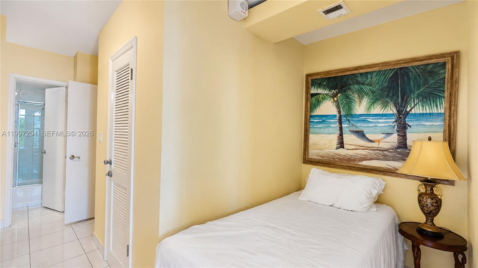 100 Lincoln Road, Unit 422 Miami Beach, FL 33139 - Photo 13 of 23 a bedroom with a bed and large window