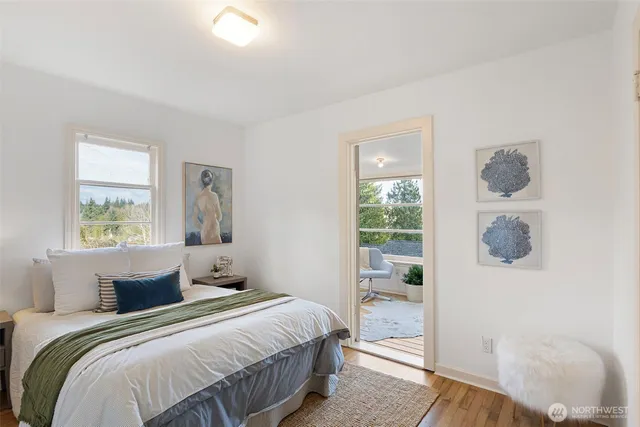 a balcony with furniture and a potted plant