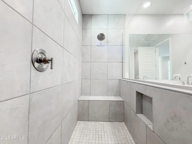a bathroom with a sink and mirror