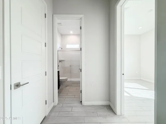 a bathroom with a glass door shower