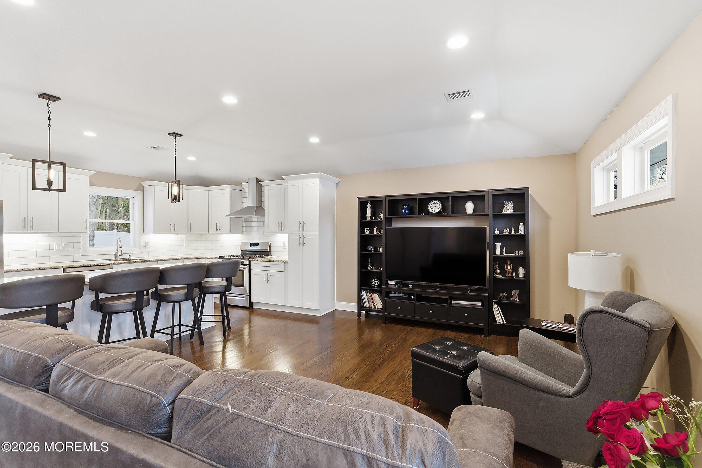 749 Hardean Road Brick, NJ 08724 - Photo 12 of 22 a living room with furniture and a flat screen tv