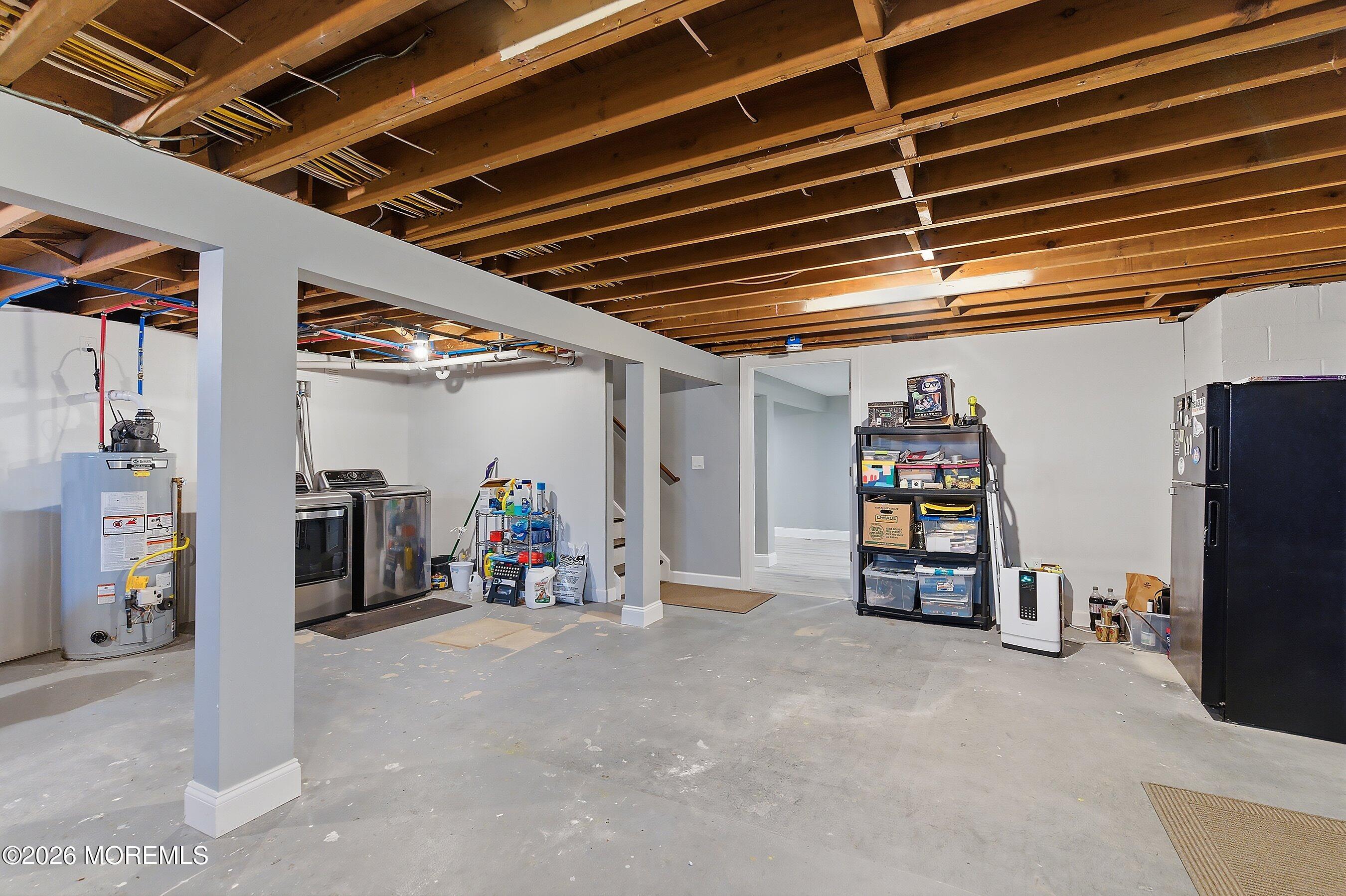 749 Hardean Road Brick, NJ 08724 - Photo 5 of 22 a view of a storage room with shelves