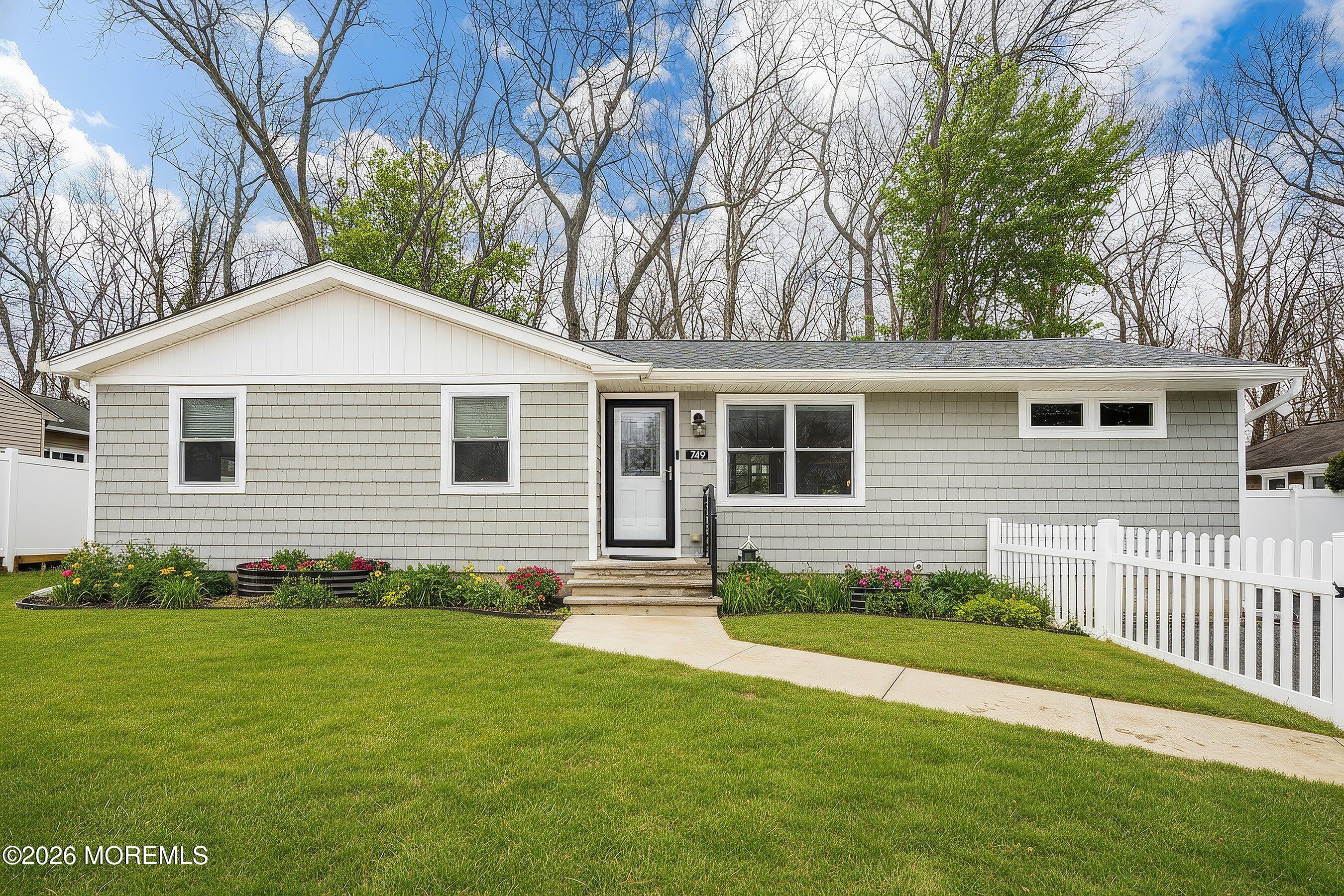 749 Hardean Road Brick, NJ 08724 - Photo 10 of 22 a front view of a house with a yard