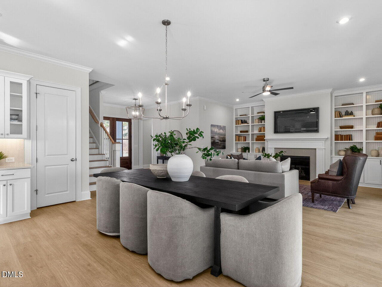 8912 Thompson Mill Road Wake Forest, NC 27587 - Photo 23 of 41 a dining hall with furniture wooden floor and a fireplace