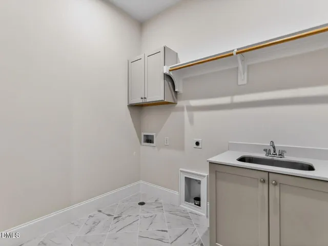 a bathroom with a sink and cabinets