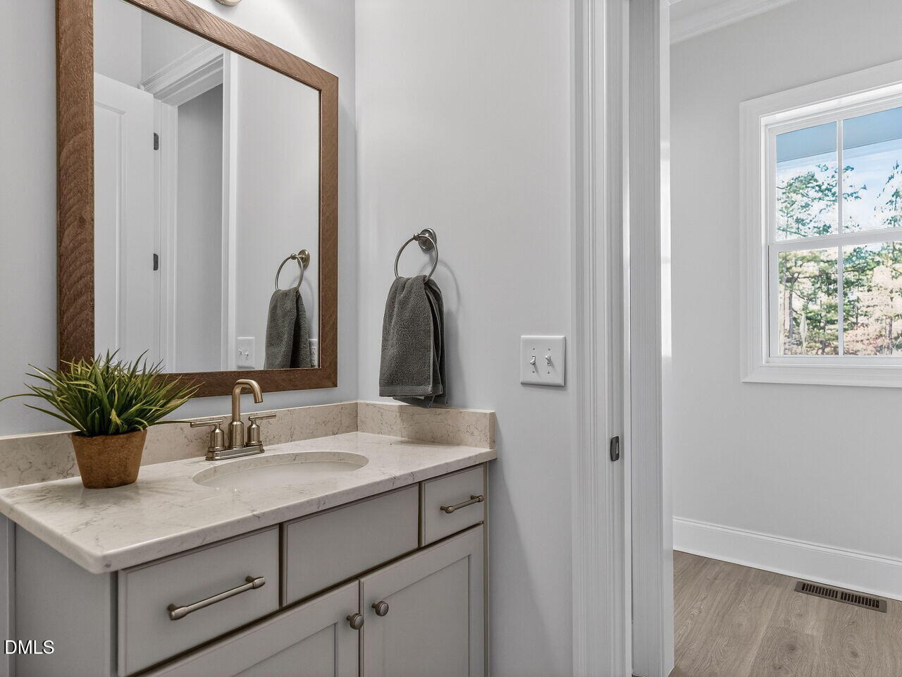 8912 Thompson Mill Road Wake Forest, NC 27587 - Photo 27 of 41 a bathroom with a sink and a mirror