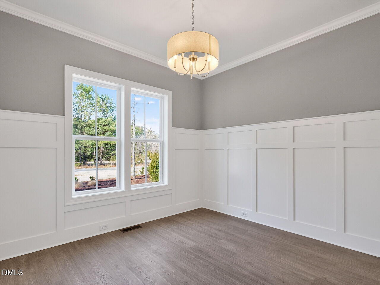 8912 Thompson Mill Road Wake Forest, NC 27587 - Photo 28 of 41 a view of an empty room with a window and wooden floor