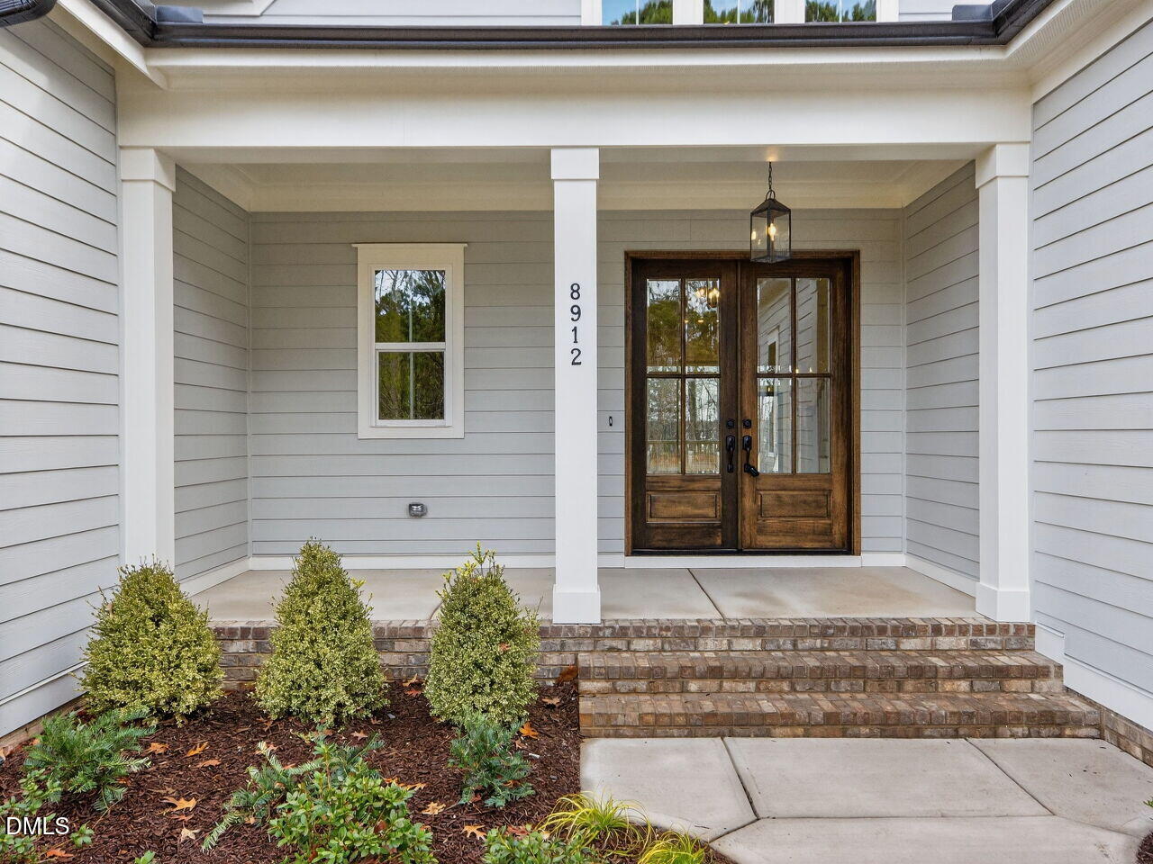 8912 Thompson Mill Road Wake Forest, NC 27587 - Photo 3 of 41 a front view of a house with a yard