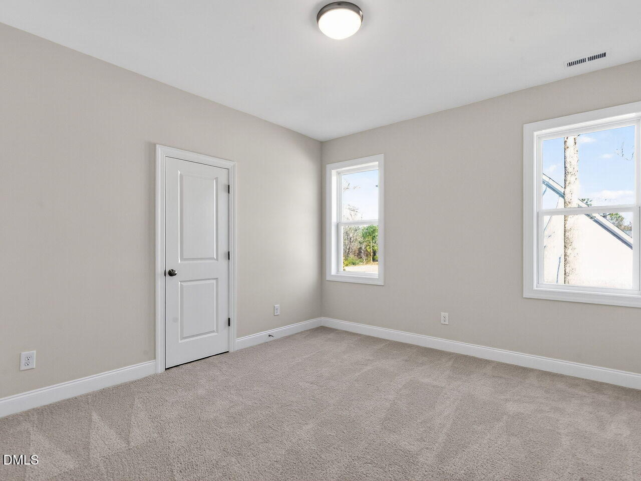 8912 Thompson Mill Road Wake Forest, NC 27587 - Photo 38 of 41 an empty room with windows and closet