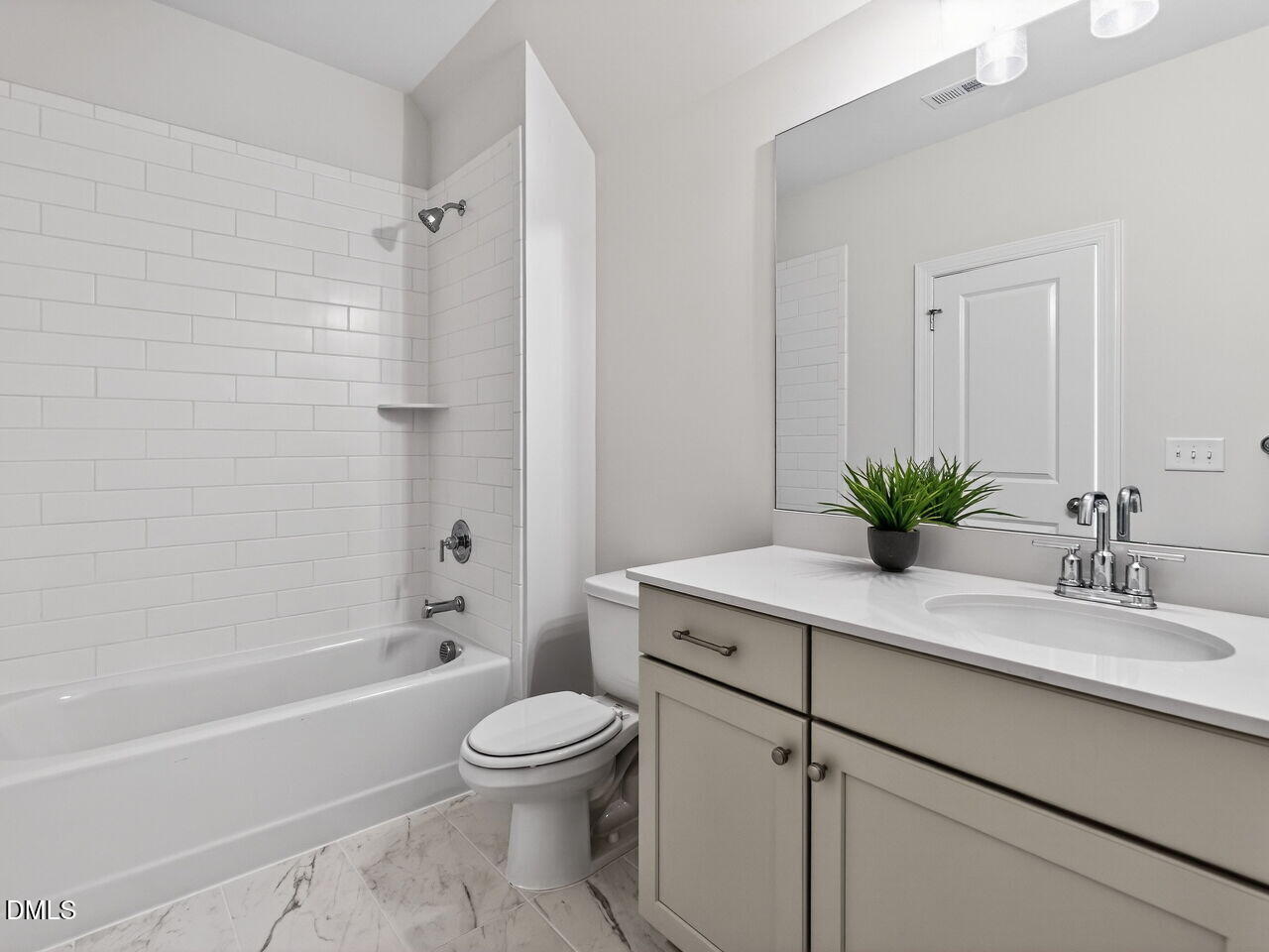 8912 Thompson Mill Road Wake Forest, NC 27587 - Photo 41 of 41 a bathroom with a sink a toilet and shower