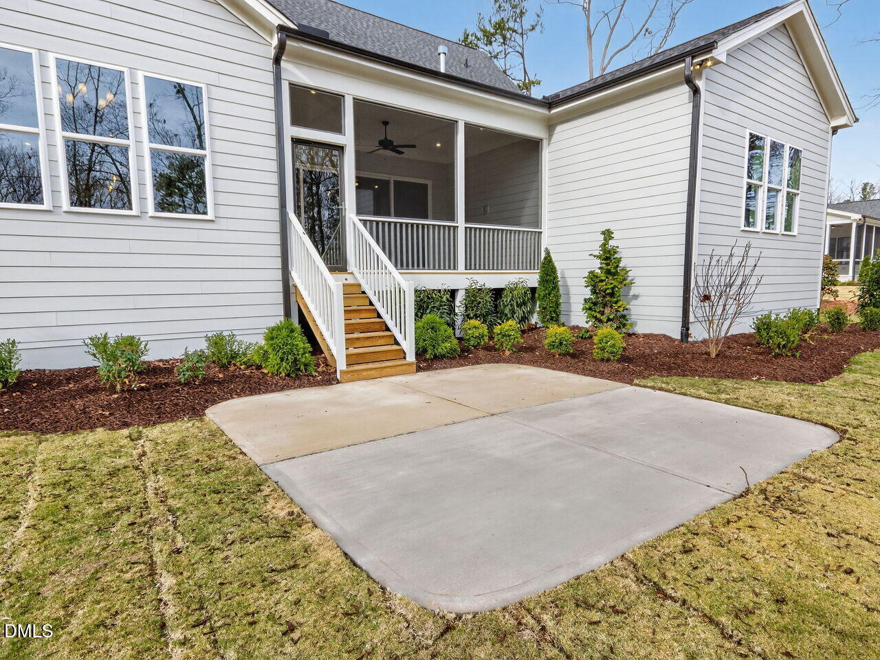 8912 Thompson Mill Road Wake Forest, NC 27587 - Photo 5 of 41 a front view of a house with a yard and potted plants