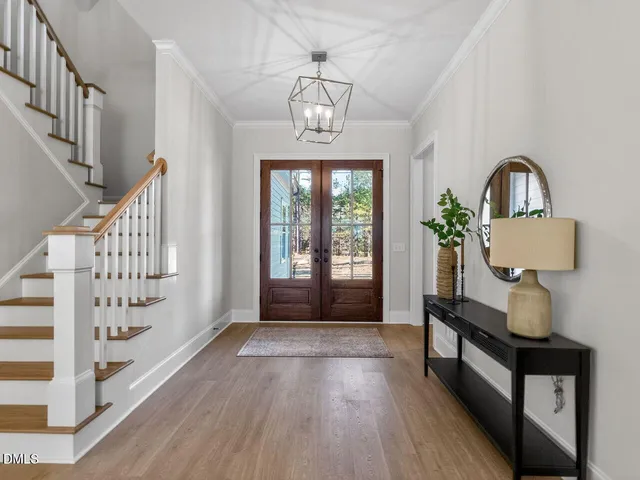 a view of entryway with wooden floor and windows