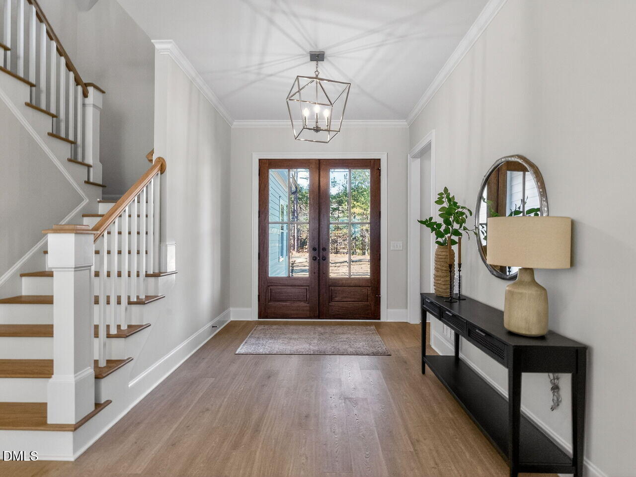 8912 Thompson Mill Road Wake Forest, NC 27587 - Photo 9 of 41 a view of entryway with wooden floor and windows